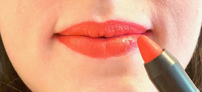 Lips with coral lipstick pencil
